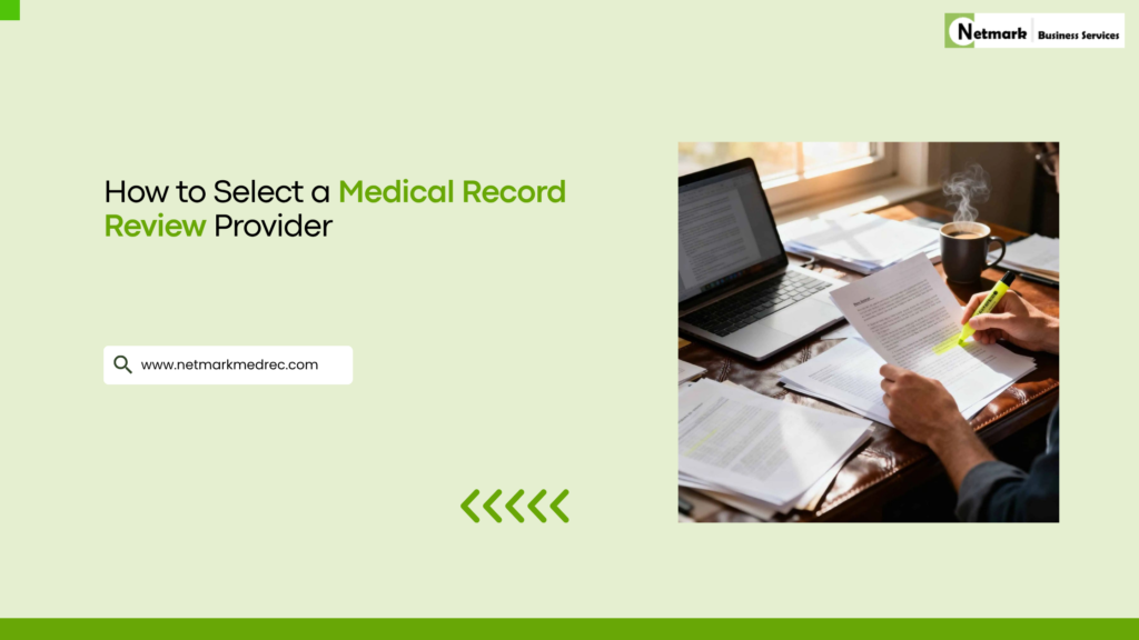 NetmarkMedRec professional reviewing and highlighting medical records while working on a laptop.